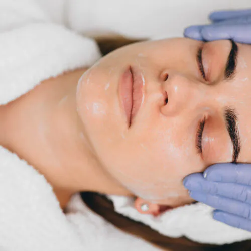 Close-up of a woman showing stunning Laser Genesis before and after skin improvements at Alicia Lowther Aesthetics in Gladstone, QLD.